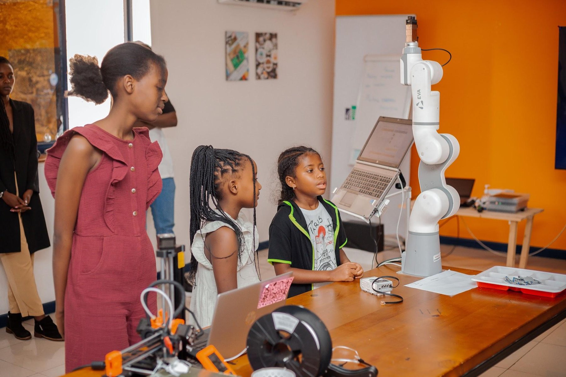 Jacky learning about an Eva robotic arm